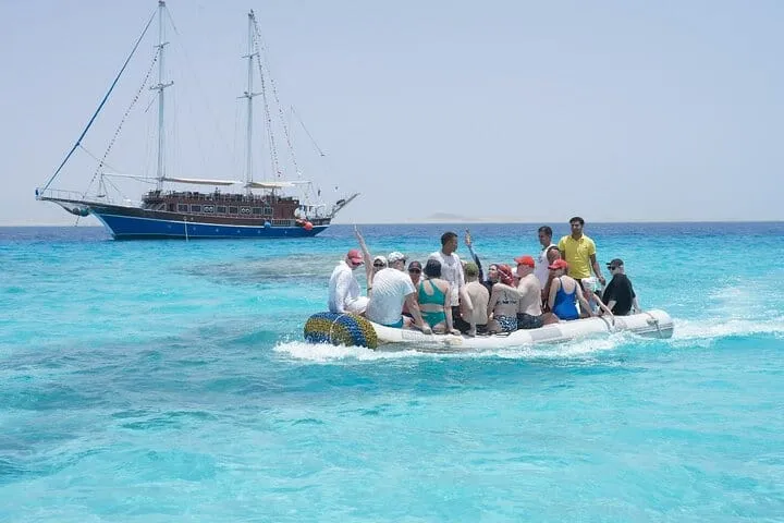 Guests snorkelling on a coral reef near Marsa Alam