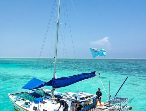 Clean and open-air catamaran offering panoramic ocean views and easy access to the water.