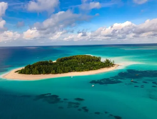 Explore Mnemba Island’s turquoise waters, snorkel over colorful coral reefs, and enjoy drinks and lunch on this unforgettable full-day adventure!