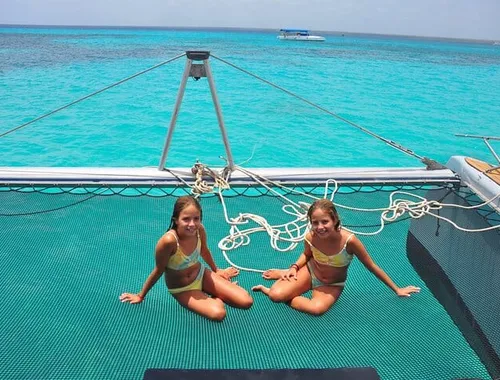 Relax on the bow trampoline with stunning views of the turquoise Caribbean sea
