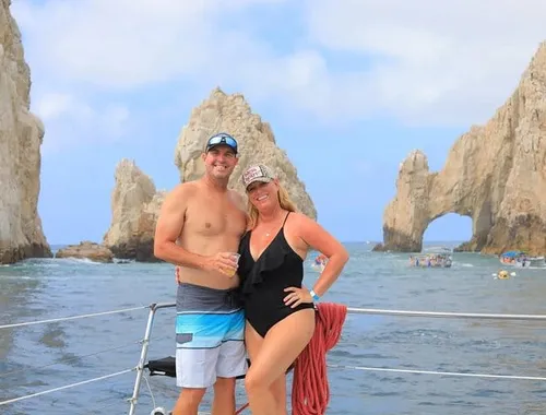 Snap your postcard-perfect memory: Pose with your partner against the magnificent backdrop of Cabo's legendary El Arco on this unforgettable catamaran cruise.