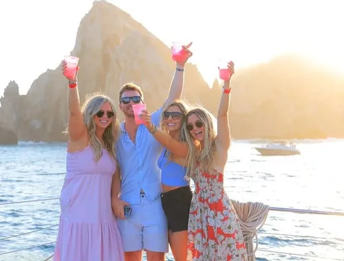 Toast to golden-hour views as you sail past the famous Arch on your private Los Cabos catamaran—drinks, sunshine, and unforgettable moments included.