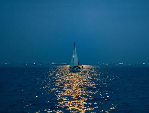 cover image of the 2.5h Full Moon sailing experience in Sotogrande Boat floating above the flash and unfurling sails