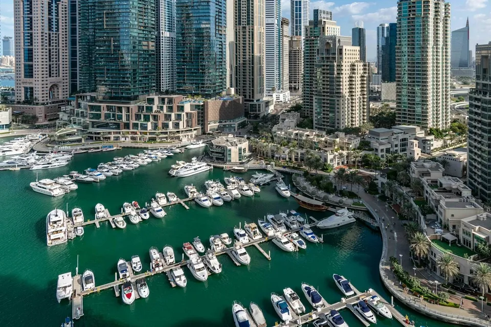 Aerial view of Dubai Marina with its towers and yachts. Photo via Unsplash