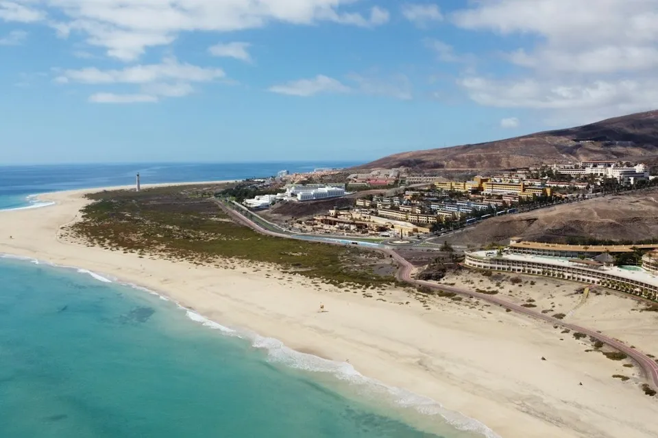 Aerial view of the beach and the lighthouse of Morro Jable, Fuerteventura. Photo via Unsplash