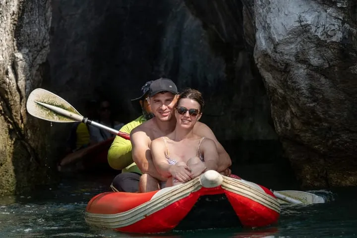 Guests kayaking into a cave in Phang Nga Bay, Phuket