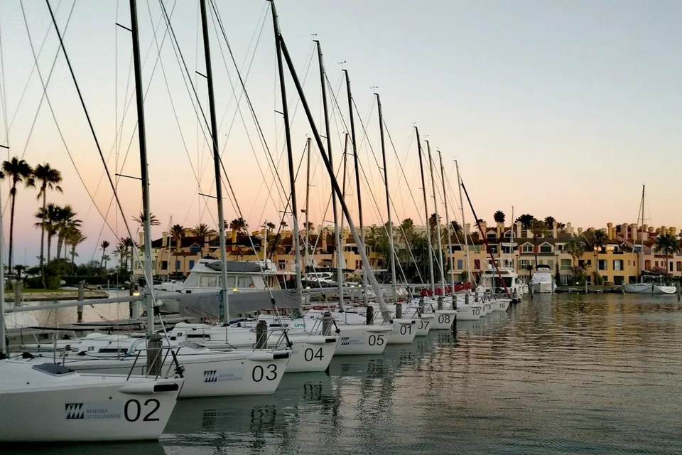 Sailboats moored at Marina de Sotogrande at sunset. Photo via Unsplash