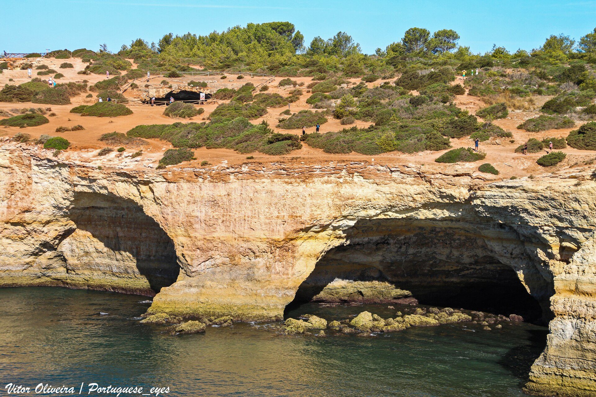 Golden Algarve cliffs with sea-carved caves near Benagil