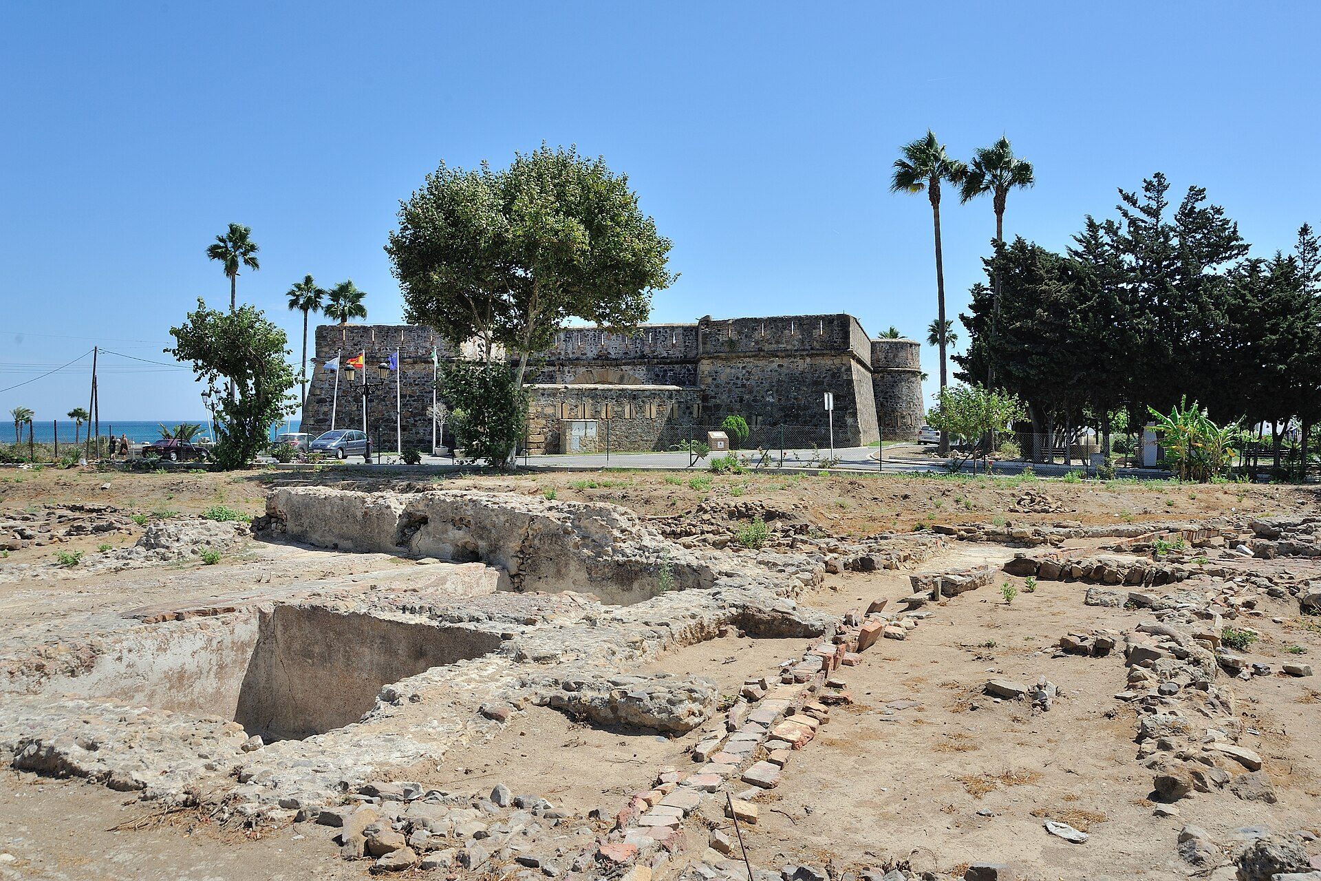 Excavated remains of the Roman villa with Castillo de la Duquesa in the background