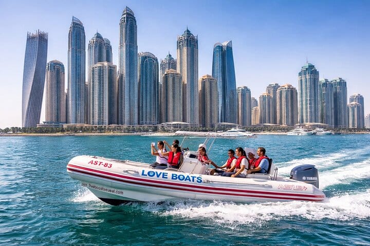 A speedboat in front of the Dubai Marina towers