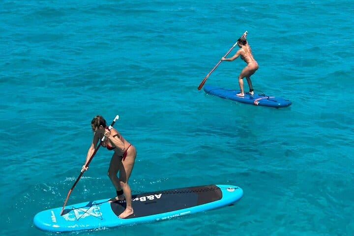 Paddle surfing in turquoise water, one of the activities of the day